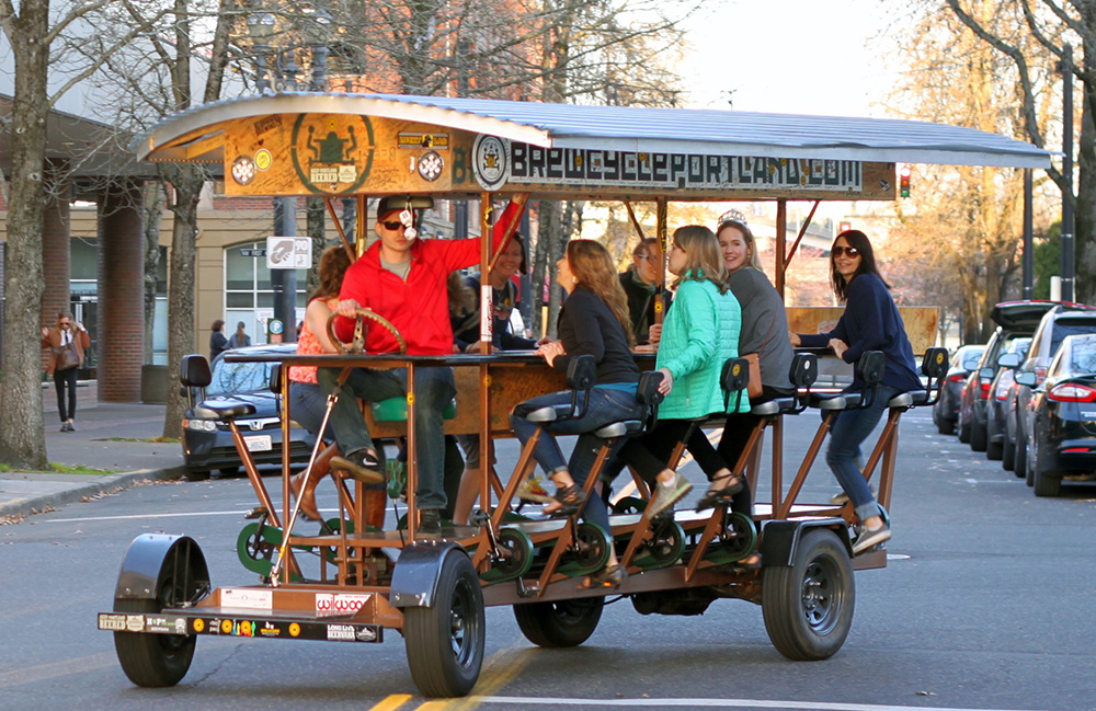 The BrewCycle rides through Old Town Portland