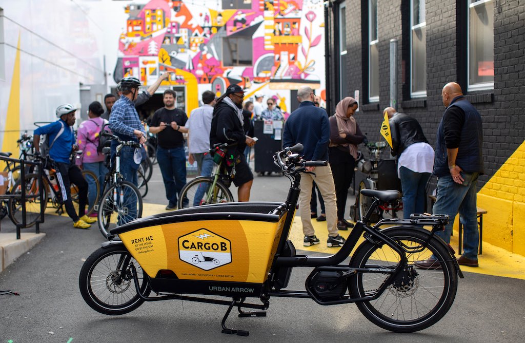 CargoB launches the on-demand electric cargo bike share system in North America. Beginning in the spring of 2024, CargoB co-founders Dorothy Fennell and Zack DeClerck lunched app-based access to a fleet of Urban Arrow bikes purpose-built to carry heavy or large loads, with locations in Boston, Cambridge, and Somerville, Massachusetts.