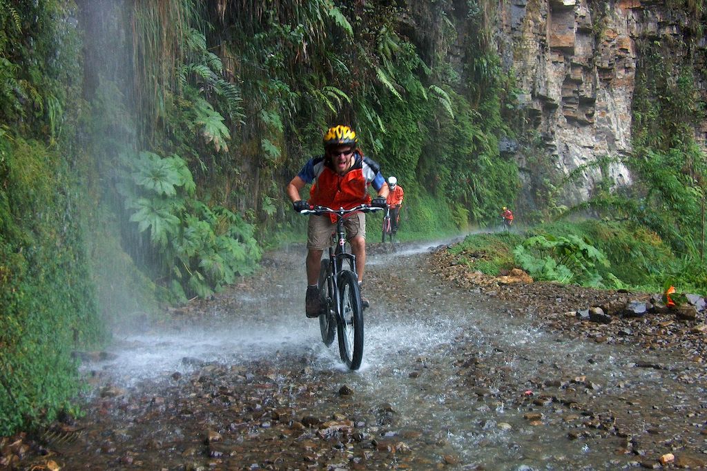 a photo of a cyclist riding down the Death Road