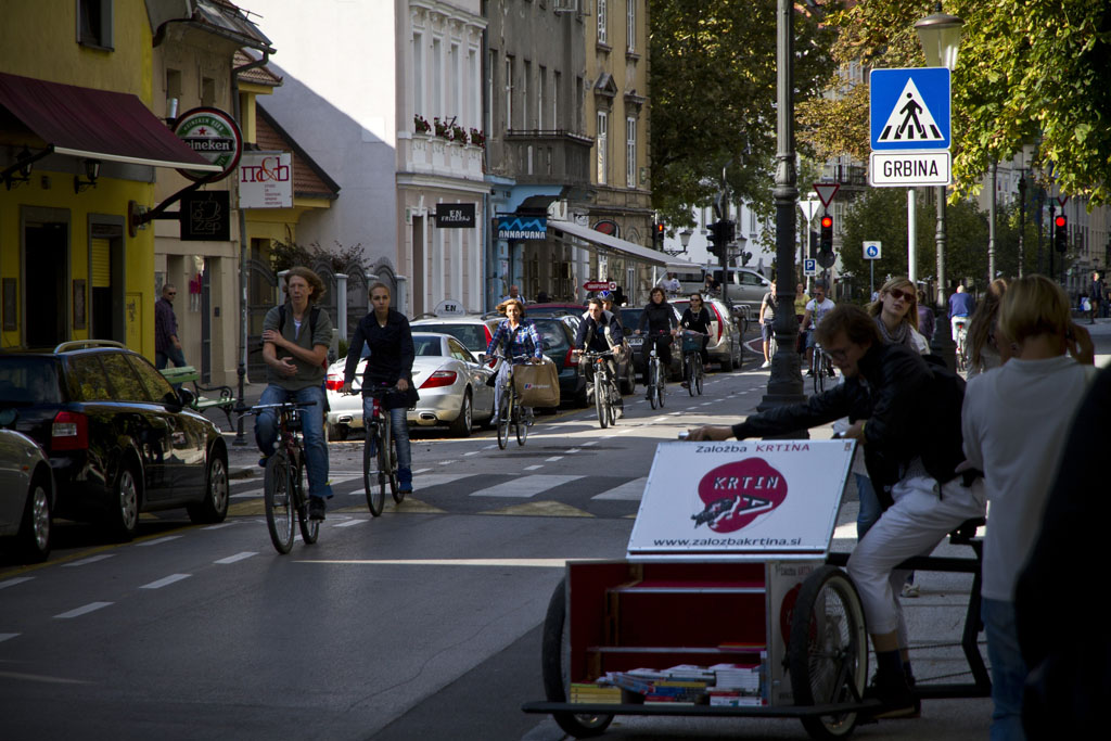 Afternoon traffic on the left, the Library Bike in Ljubljana on the right.