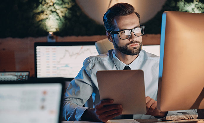 a man looking at a computer