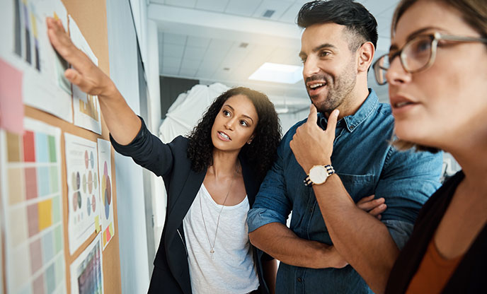 Three social media marketing agency experts discussing strategy and project ownership