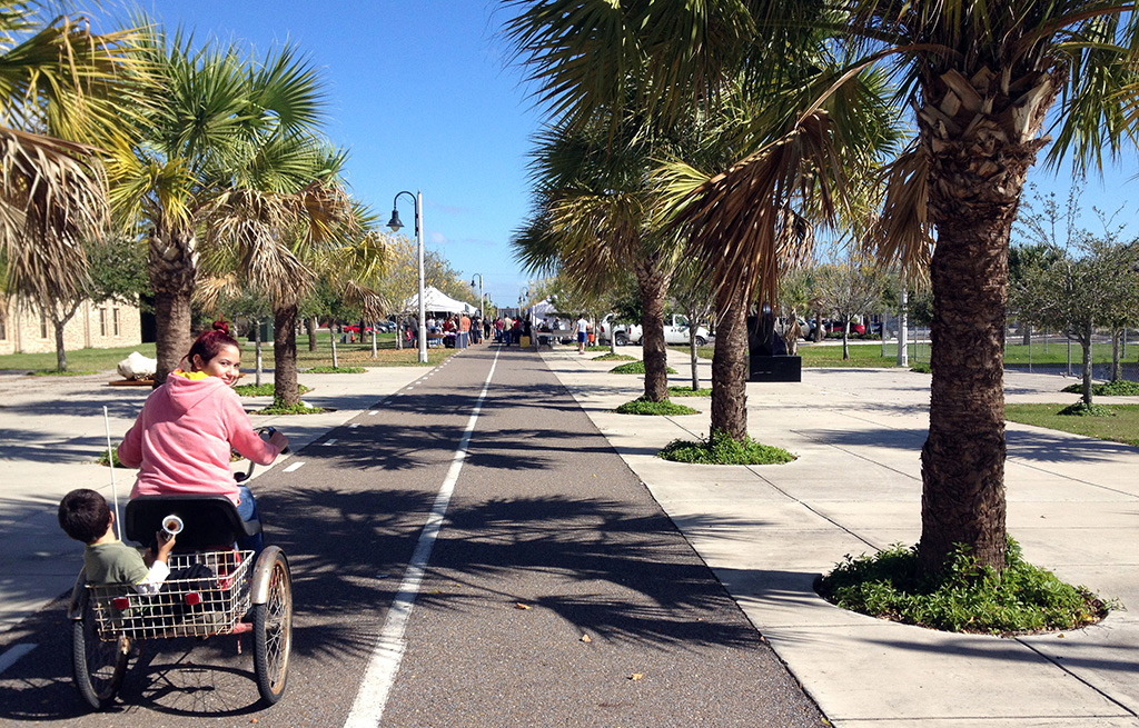 Nikole Gutierrez and Santiago Joyas at the beginning of the Historic Battlefield Trail on their way to the Brownsville Farmer's Market. Photo by Eva Lizette Garcia.